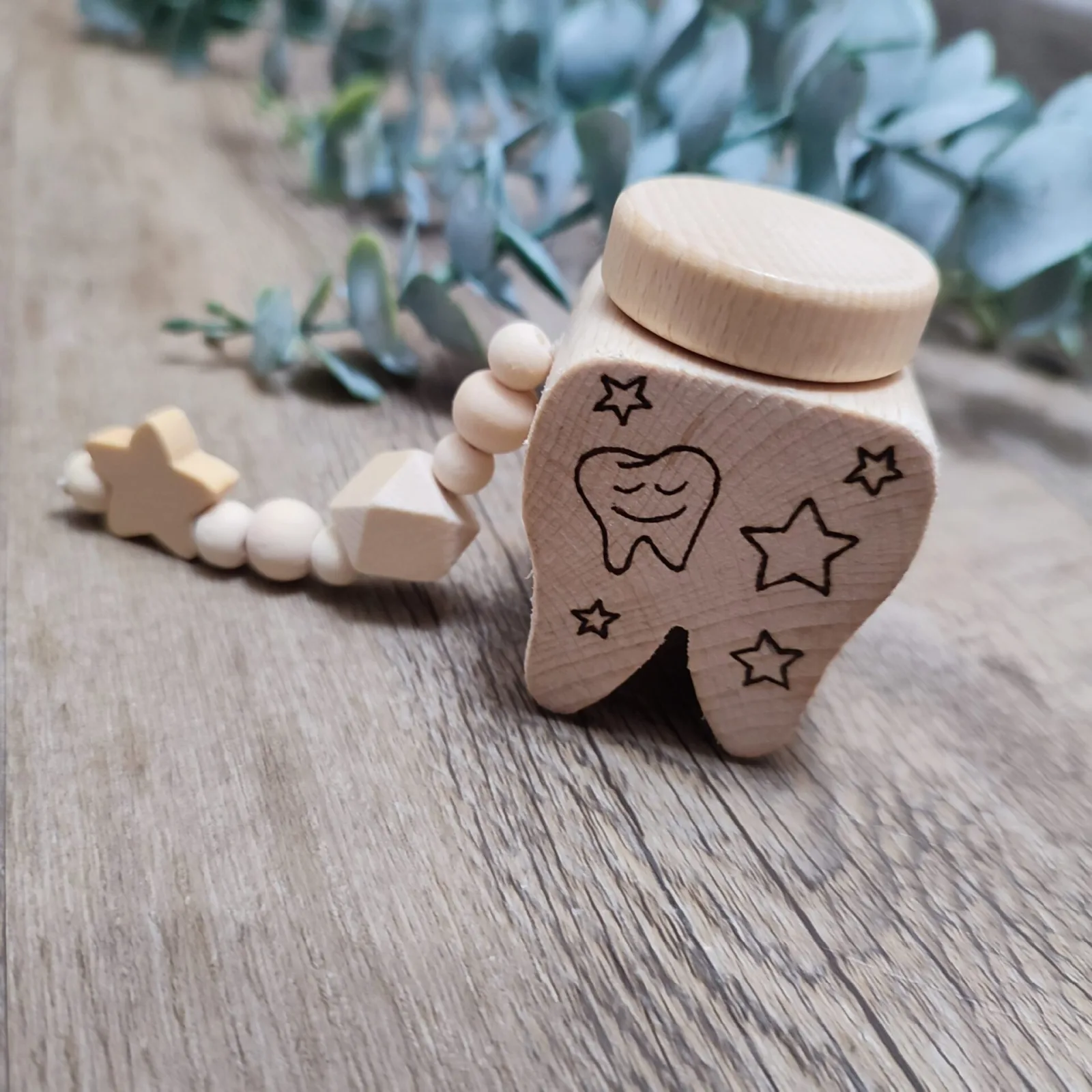 Milchzahn mit Holzperlen